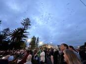 Hundreds of Lorikeets take flight over the Anzac Day crowd at South West Rocks.