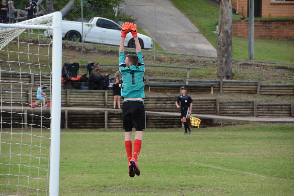 Strikers keeper Corey Forbes didn't have a busy day at the office given the dominance of the Nambucca side, but he did get vertical to watch this one balloon over the top