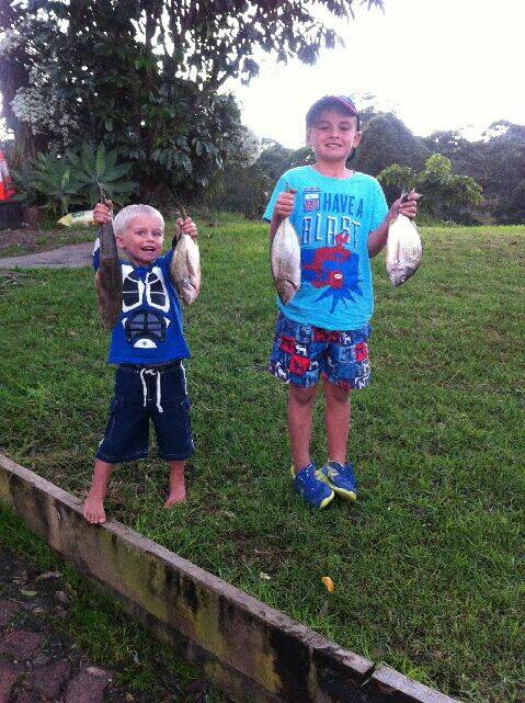 HAPPY LADS: Ashton and Jairah with their respective catches