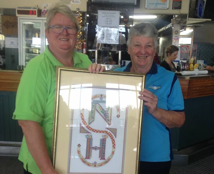 The captains of Nambucca and Sawtell, Henny Oldenhove and Kerrie Pitman, with the Celtic Shield