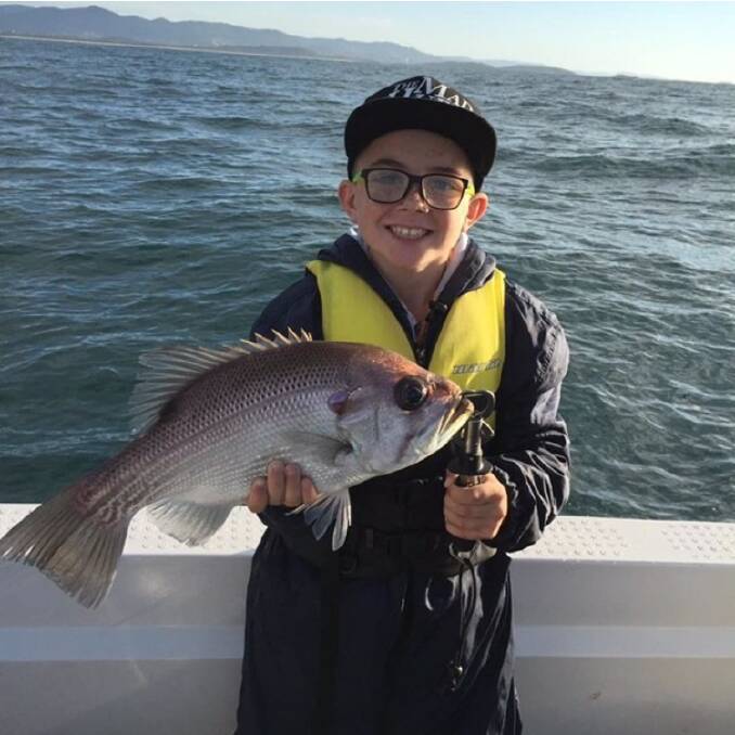 Riley Partridge, aged 10, caught a 75cm snapper and a pearl perch on soft plastics and jig deep sea fishing off Coffs Harbour