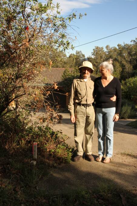 Gordon and Karen standing on the edge of their property. To the left, and just mere centimetres away is a pink peg which indicates the project boundary.