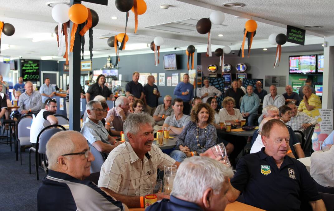 A large crowd gathered under orange, black and white balloons at the Nambucca Heads Leagues and Sports Club for a packed afternoon
