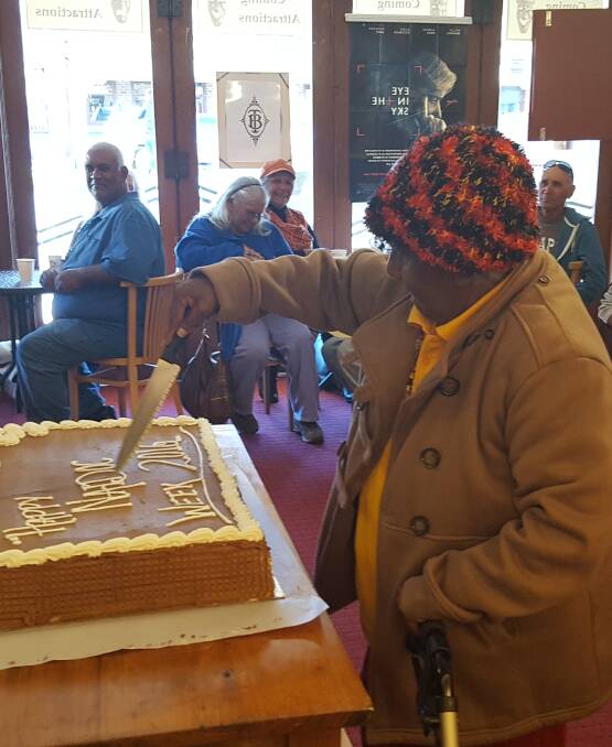 Aunty Shirl Ballangarry cutting the cake at the Bowraville Theatre morning tea where 30 Elders and 50 community members and kids attended