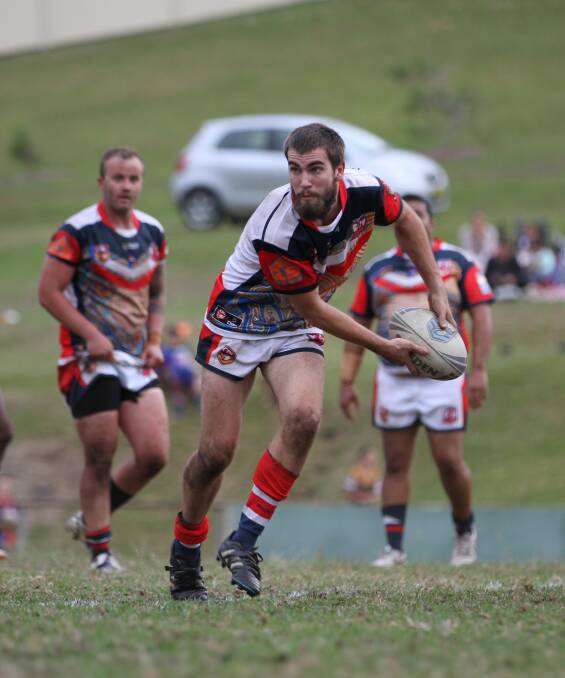 INDIGENOUS ROUND: The home side put in a fiery effort against Macksville. Pictured is first grade's Jacob Welsh ready to offload the ball. Behind him is Matt Field and Bert Gray