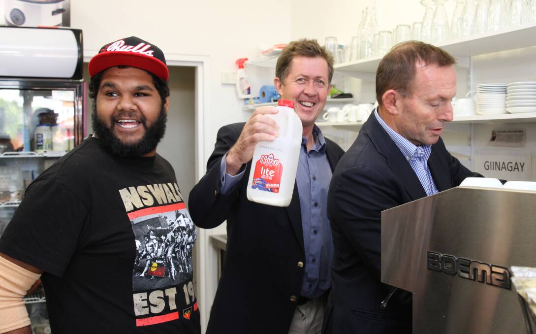 NEVER TO YOUNG TO LEARN: Graduate Kieran Jarrett teaches former Prime Minister Tony Abbott and Luke Hartsuyker to make barista-style coffee