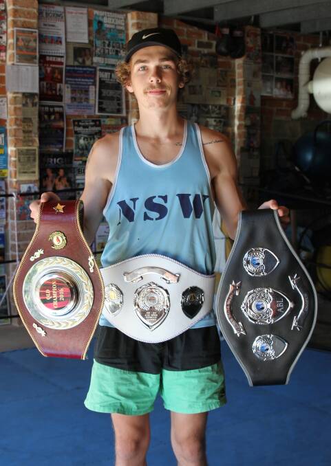 Mitchel with just some of his belts from 2016.