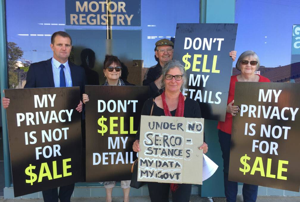 Opposition spokesperson Clayton Barr, Bowraville resident Jenni Andren, Labor Councillor Susan Jenvey, and Nambucca residents Kay and Neville McDonald protest outside the Nambucca Heads Motor Registry Office.