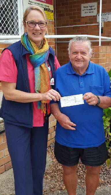 Carolyn Cross and Macksville Lions Club member, Ronnie, whose sausage sizzle fundraising efforts have made a difference to the lives of breast cancer sufferers