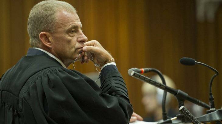 State prosecutor Gerrie Nel questions Oscar Pistorius in court on Friday.