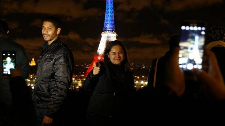 The Eiffel Tower lit up in the colours of the national flag for the second night in Paris on Tuesday.  Photo: Andrew Meares