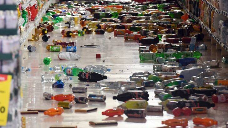 Groceries litter the aisle of a supermarket in Miramar.  Photo: AP/Ross Setford