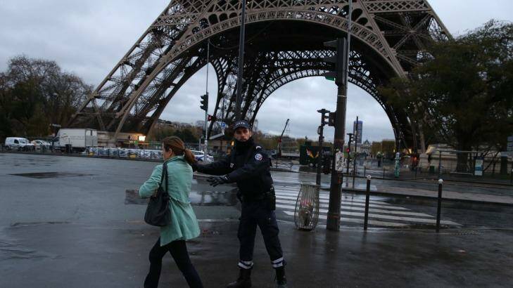 Police clear the Eiffel Tower in Paris on Tuesday.  Photo: Andrew Meares