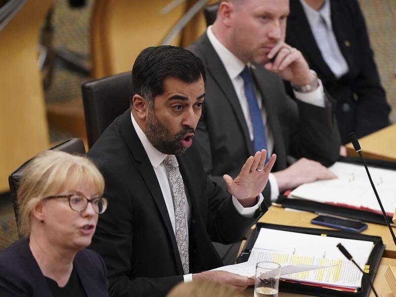 First Minister of Scotland and SNP leader Humza Yousaf (centre) will lead a minority government. (AP PHOTO)