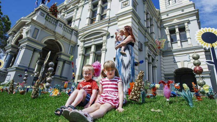 Kate Walsh with her children, Quinn five; Aidan, four; one-year-old Niamh at Leichhardt Town Hall.  Photo: Christopher Pearce