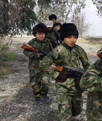 This still from a video by al-Azzam Media, an arm of Islamic State's online presence,   shows Indonesian children in training to join IS forces. Photo: Supplied