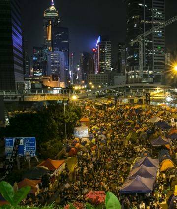 Enthralled: Tens of thousands of protesters gather to listen to the talks at the main protest site in Hong Kong.  Photo: Paula Bronstein