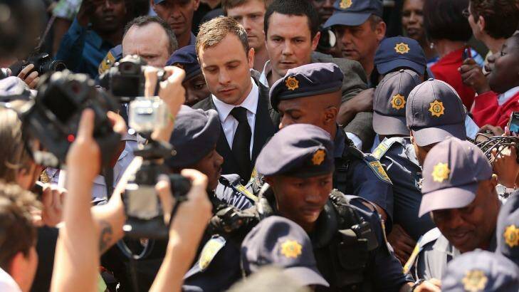 Oscar Pistorius leaves court, after being permitted out on bail. 