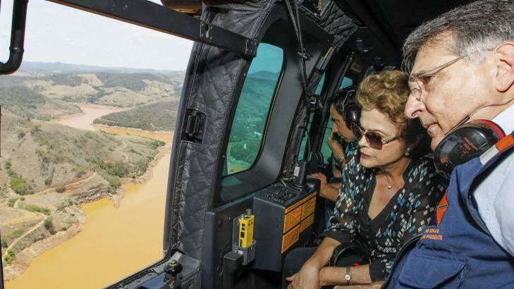 President Dilma Rousseff accompanied by Minas Gerais state Governor Fernando Pimentel, looks out over the dam site. Photo: Handout/AP