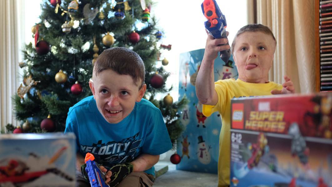Fletcher and Spencer ensured Santa found them by helping him out with a sprinkling of special 'Santa Dust'. Picture: Grant Wells.