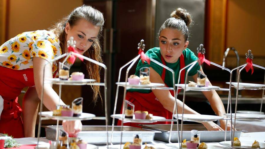 CRUNCH TIME: Bowraville’s Billie McKay and fellow contestant Sara scramble to get
their creations to the pass in the exacting high tea challenge. Photo: MasterChef Australia