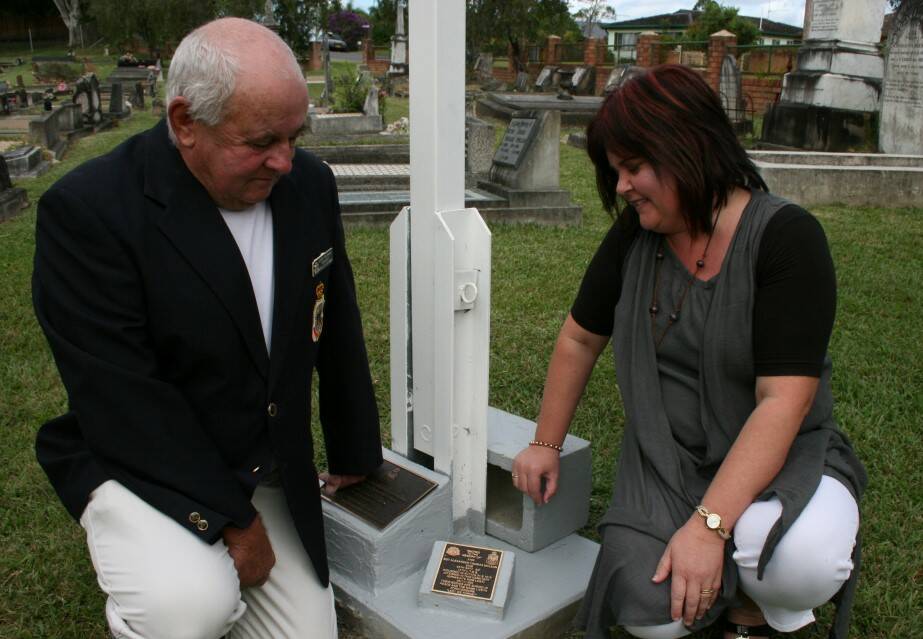 LASTING MEMORY: Barry McDonald and Karly Lane with the new plaque honouring Sergeant Alex McLean in Macksville Cemetery