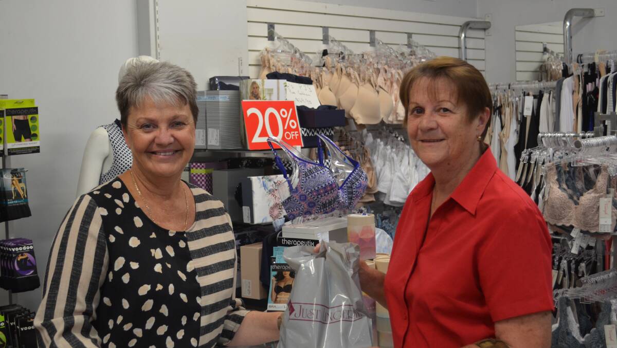 HELPFUL: Owner of Just Lingerie Vivian Kyle helps Cheryl Askew finalise her purchase during last year's 'Crazy Day' sale.
