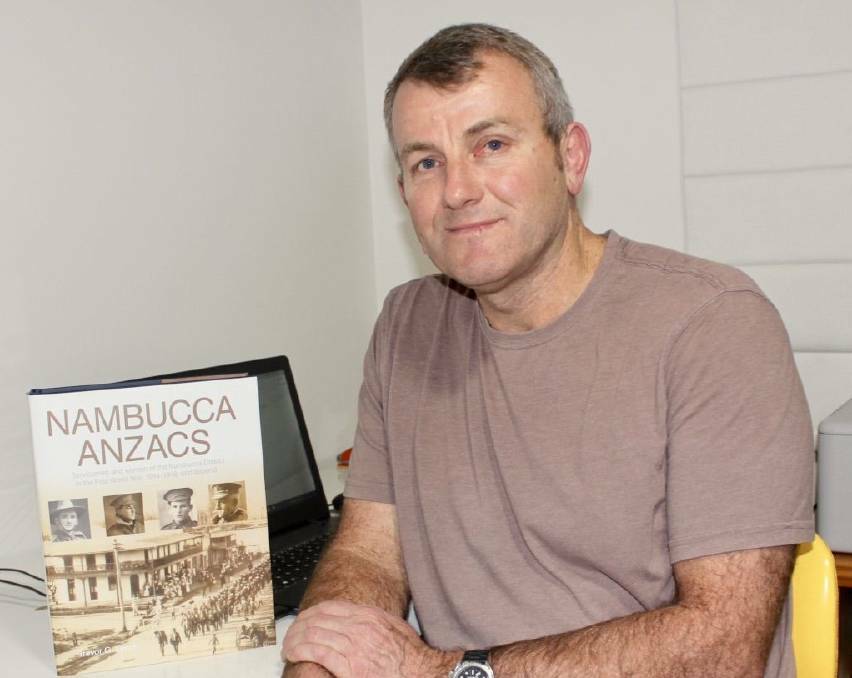 Trevor Lynch with the book he produced, Nambucca ANZACs