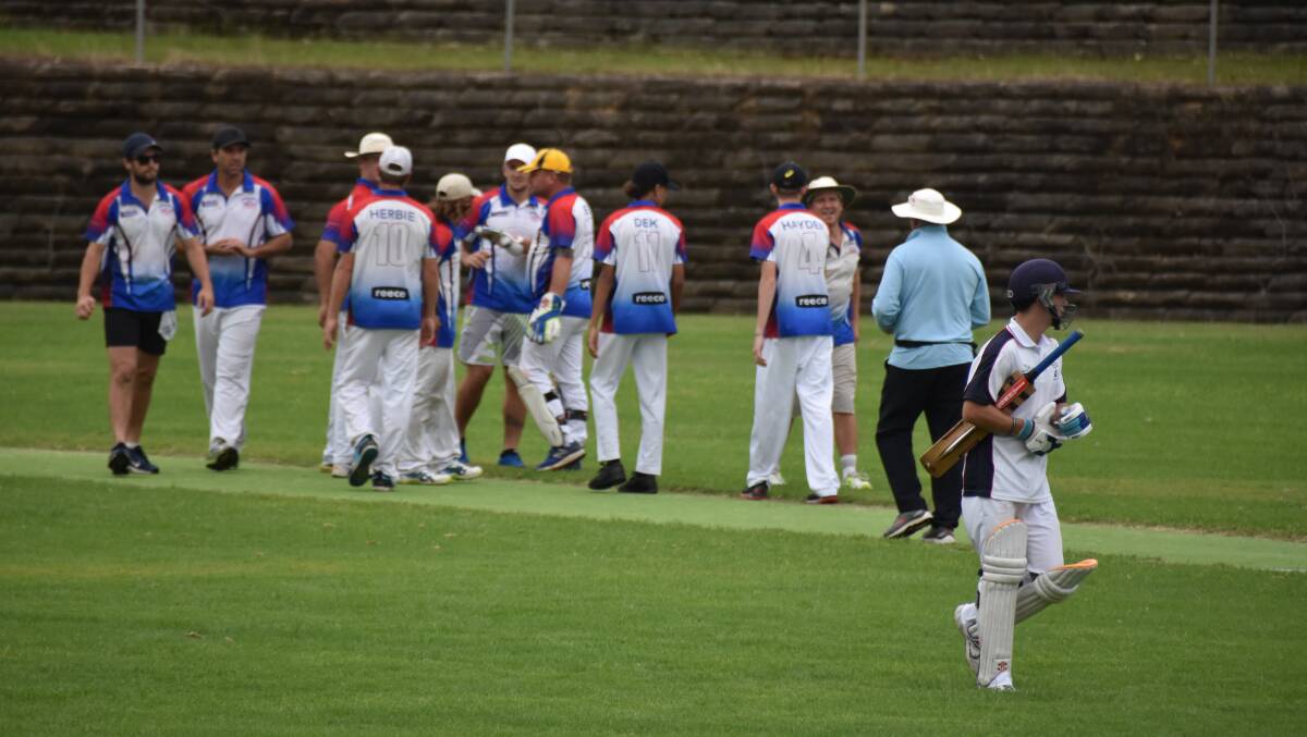 Nambucca Heads players come together after a Scotts Head fall of wicket