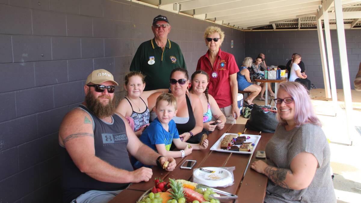 The Lions District Governor John Davis with Macksville Lion Cathie Vine, back left, and Chris and Mychelle Knight and their children. Photo by Tony Vine