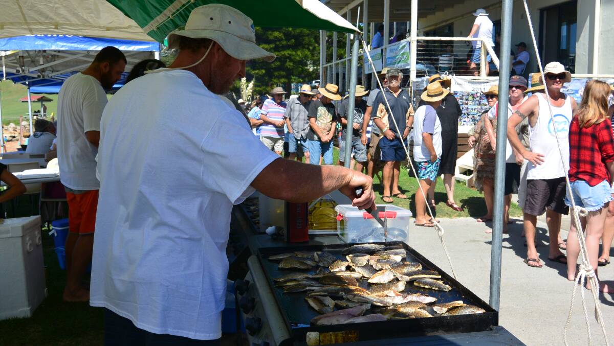 Local fisher Brad Holden cooking mullet for the hordes last year