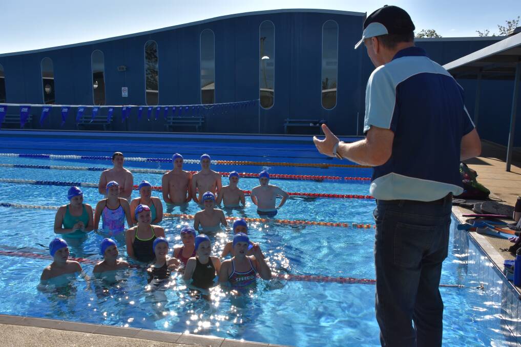Guest coach Chris Myers working with the Macksville Marlins swimmers