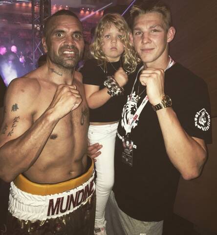Mitchell Whitelaw (right) with his daughter and Anthony Mundine