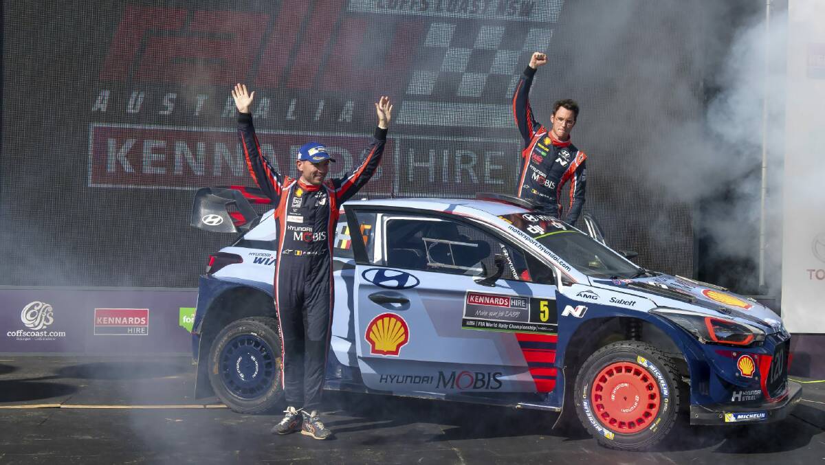 Thierry Neuville (right) and co-driver Nicolas Gilsoul celebrate beside their Hyundai after winning Kennards Hire Rally Australia today (Jeremy Rogers pic)