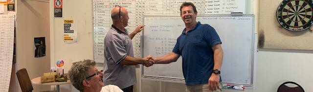 David Hosking (right) is congratulated by Michael Simpson at the Macksville Golf Club presentations