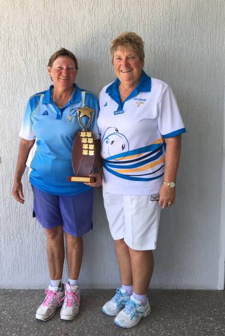 Ros Hancock with her Under 5s trophy. Also pictured is district president and Urunga bowler Shirley Willis