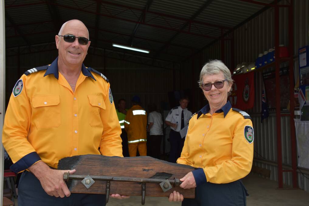 Gumma Captain Rob Mills and South Arm Captain Gail Perry with the special plaque