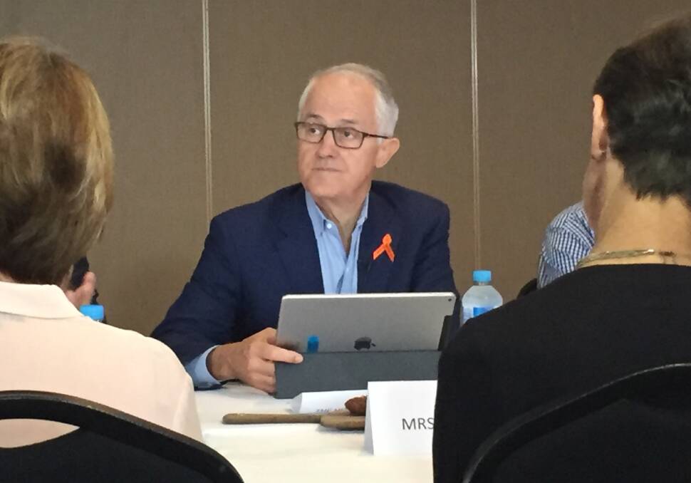 Here to talk: Prime Minister Malcolm Turnbull on Wednesday hosted a roundtable in Port Macquarie to hear from 12 self-funded retirees about an Opposition plan to change the existing tax imputation credit system. Photo: Peter Daniels