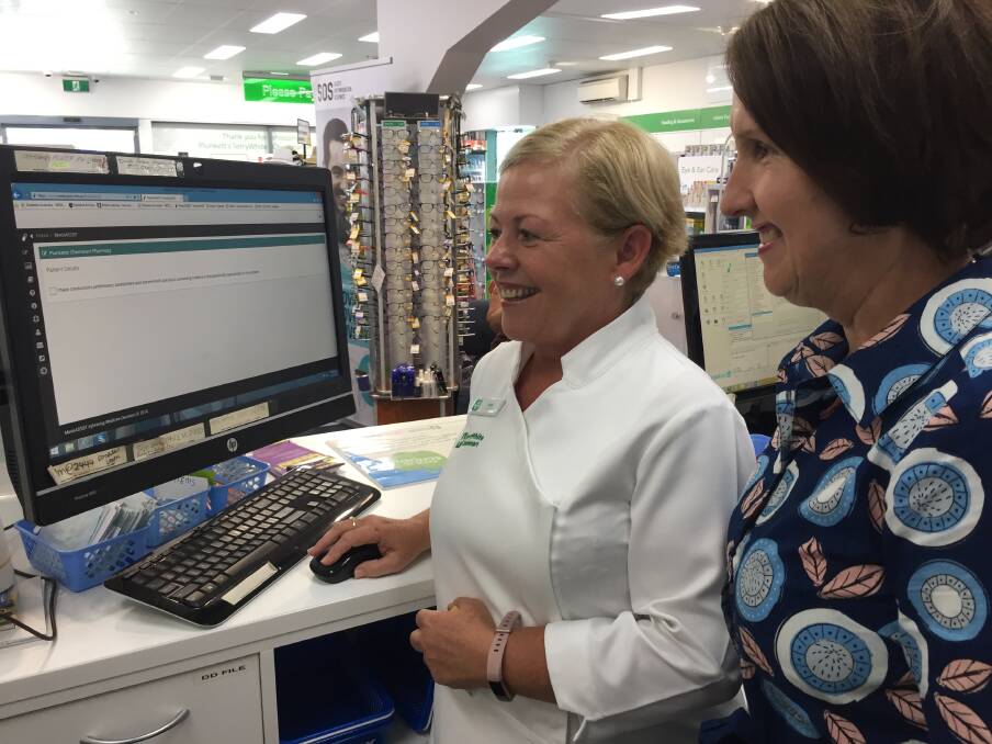 Test drive: Pharmacist Judy Plunkett and Port Macquarie MP Leslie Williams discussing the impending removal of codeine-containing medicines.