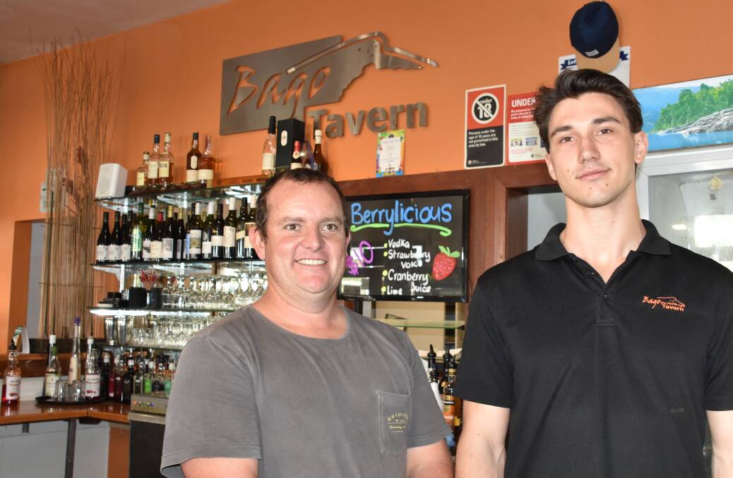 AT THE BAGO TAVERN: Licensee Paul Dodd with staff member Jack Parker