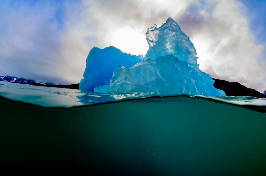 A split shot of an iceberg. Picture: Brett Lobwein 