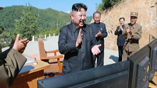 North Korea leader Kim Jung-un, centre, applauding after the launch of a Hwasong-14 intercontinental ballistic missile (ICBM) last month. Photo: AP
