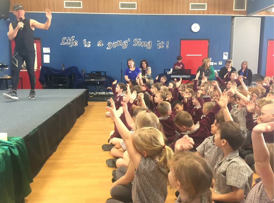 St Patrick's Primary students were armed with questions for Andrew about his Million Dollar Run and the Butterfly Children.