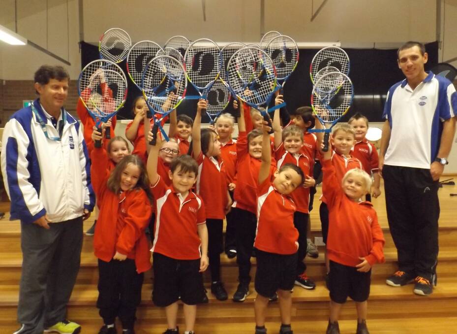 Kinder Dolphins hold up their brand new racquets