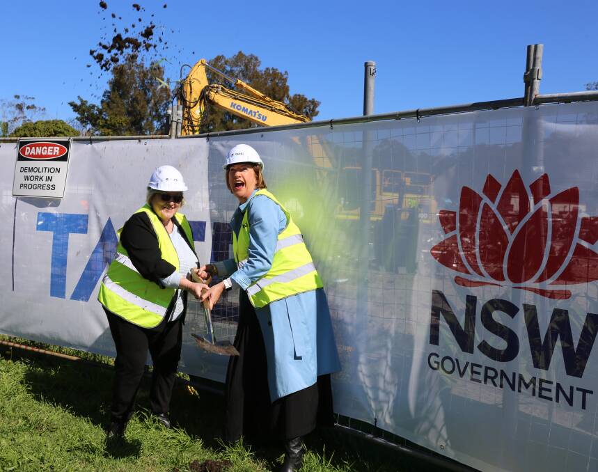 Cr Janine Reed and Member for Oxley Mel Pavey turn the first sod with gusto
