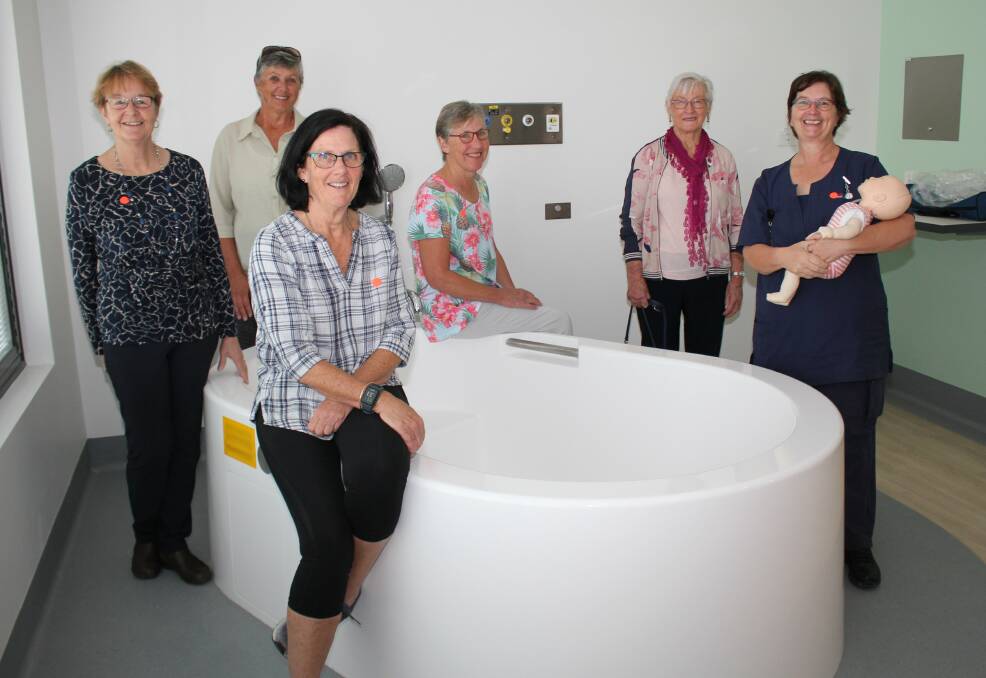 UHA volunteers Chriss Tate, Dee Hunter, Maureen Parkyns, Heather Edwards and President Isabelle Hooper with midwife Susan Brown at one of the birthing baths donated by the BowraMacksville volunteers to the new Macksville District Hospital. 