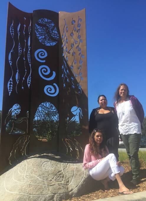 (Clockwise from top right) Annalisa Wilson, Francine Edwards and Denise Buchanan with their steel and stone sculpture: 'How the sea was made'.
