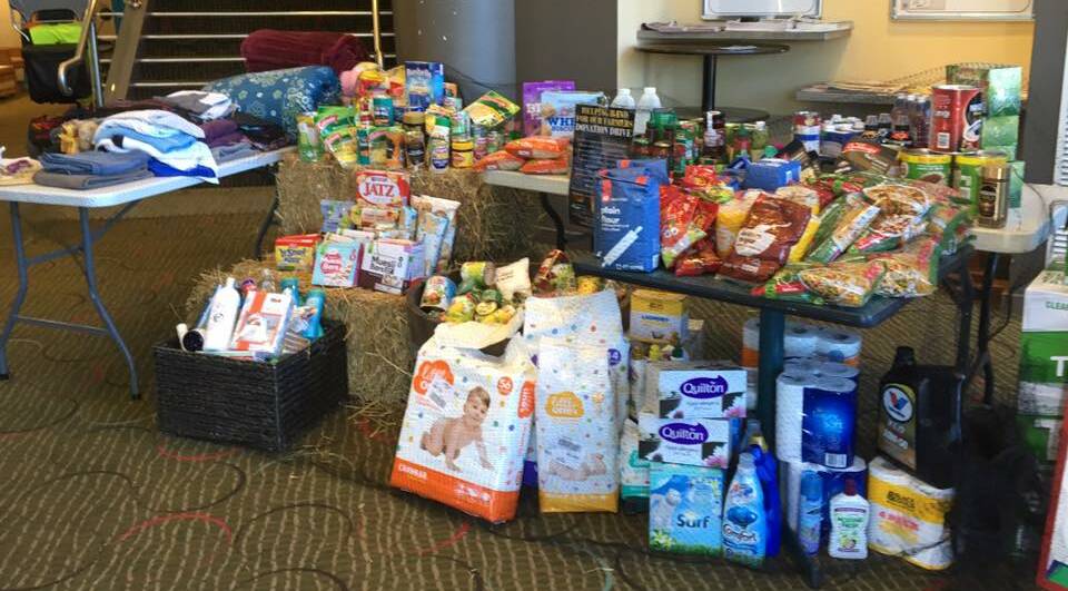 ANYTHING NON-PERISHABLE IS WELCOME: Locals have been bringing in piles of food, toiletries, baby products and household goods for the past week.