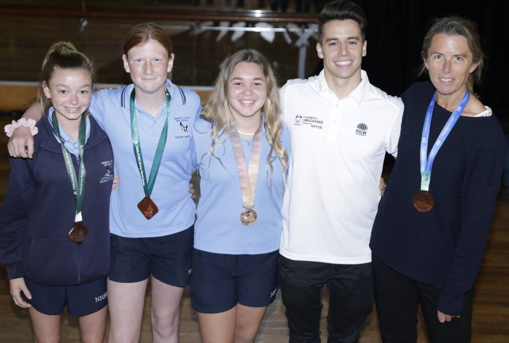 Charla, Lilly, Leanna, Declan and Michelle Versluys wearing Declan's diving medals
