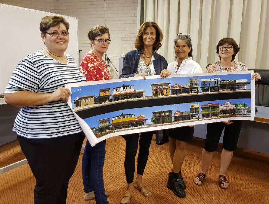 Meeting attendees hold River St schematic (L-R) Zefy Psarros, Mary Lawler, Rachel Ward, Felice Ferrer-Burton, and Lesley